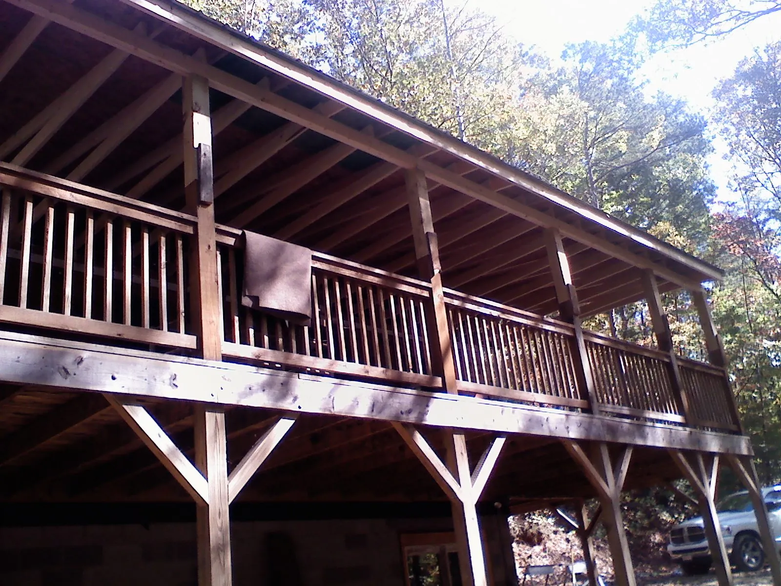 Timber framing under a new elevated porch and deck — Roof Leak Repair in Bernard by Roofing Brothers